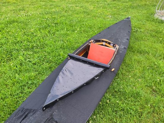 A folding kayak with a half sprayskirt