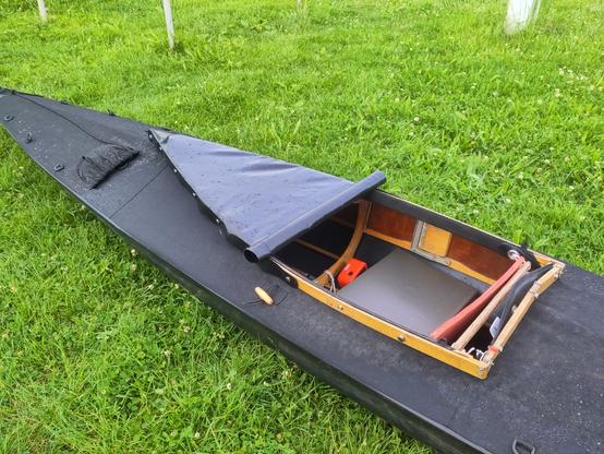 a folding kayak with half sprayskirt