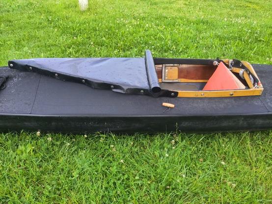 a foldimg kayak with half sprayskirt