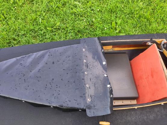a folding kayak with half sprayskirt