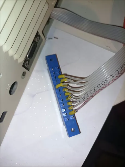 Commodore User Port parallel (burst) ribbon cable standard: red is the first wire, connected to the bottom row, to pin 'B' (/FLAG2), followed by 8 data lines. The 9th wire goes to the top row to pin '8' (/PC2).