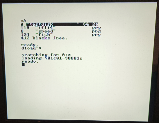 DolphinDOS 3 in C128 mode with 1571. It loads data faster than JiffyDOS but a bit slower than C64 more DD3. I think this is because the memory bank routing.