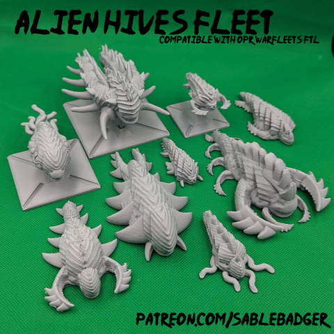 A picture of some small 3d printed bio-organic spaceships in Gray PLA plastic.