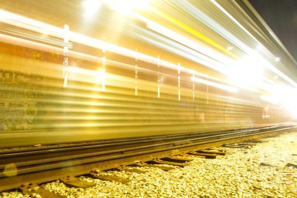 Streams of light as a train roars by.