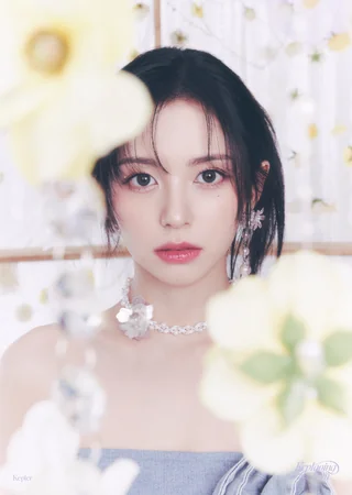 Head and shoulders portrait of Kpop idol Mashiro looking directly into the camera