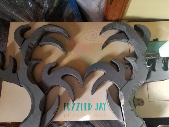 two grey EVA foam antlers on a table