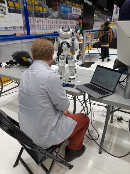 University of Oulu INTERACT researcher programming Nao robit for the Amazing North event