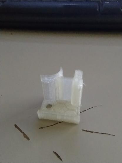 simple 3D printed filament guide to keep it from the getting into the z axis screw on an ender 3 v2.  Sorry for the poor quality picture.