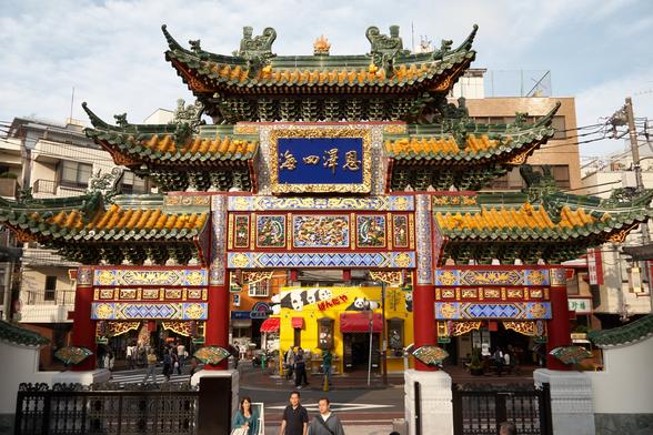 The decadent main gate to Yokohama Masobyo (Mazu Miao), a multi-story very intensely colored entrance, from this view it appears to be the approach to the amazing Panda-Ya store.