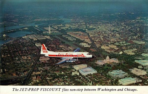 Airplane is flying over Washington DC. You can see all the famous Monuments.