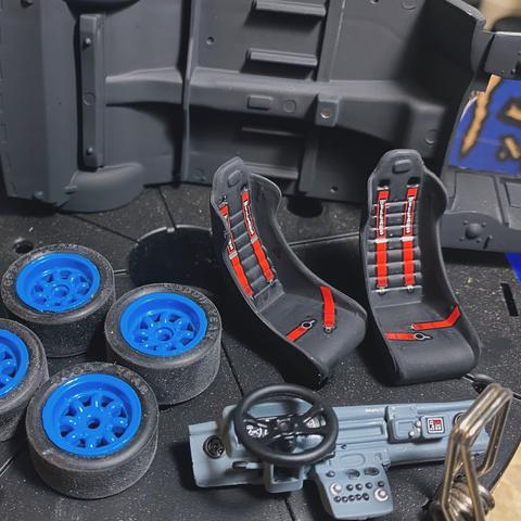 Wheels, seats and dashboard of a Ford Escort RS1800 Mk. II by Italieri in 1:24