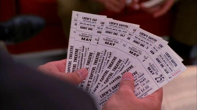 A spread of tickets to a boxing match dated May 25