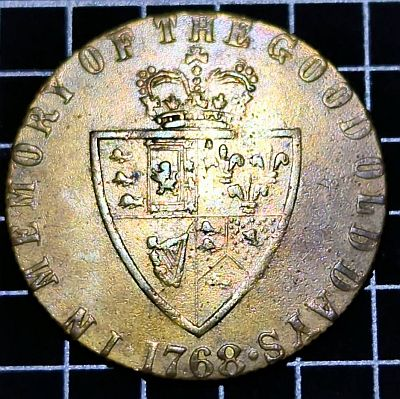 crowned spade-shaped shield with "In memory of the good old days" around the edge and the date 1768.