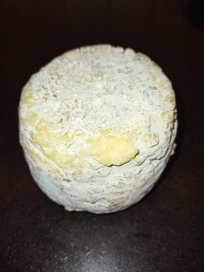 a wheel of homemade blue cheese.