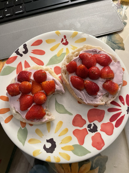 Homegrown strawberries on creemcheesed English Muffin.