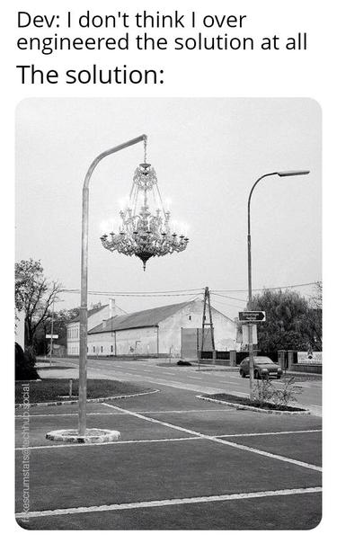 Photo of a street lamp that has a big chandelier hanging from the lamppost arm.