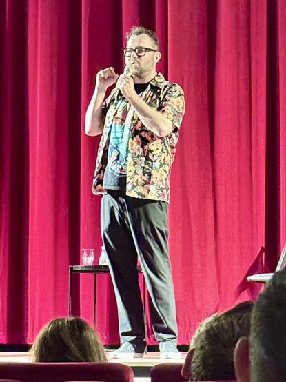 Photo of Hugleikur Dagsson during stand up comedy in Brno.