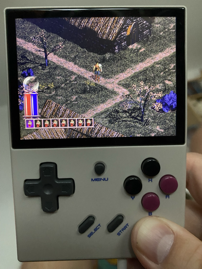 Small handheld gaming device showing Diablo 1 on the screen