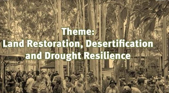 I sepia photograph of people at the markets with the words:
Theme: Land Restoration, Desertification and Drought Resilience
.verlaid