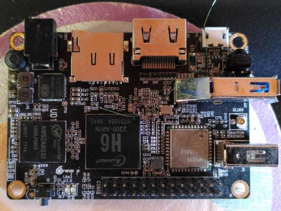 xulong Orange Pi Lite 2 (Allwinner H6) single board computer with two enameled wire soldered to (what i believe) is CMD and CLK sdio signals