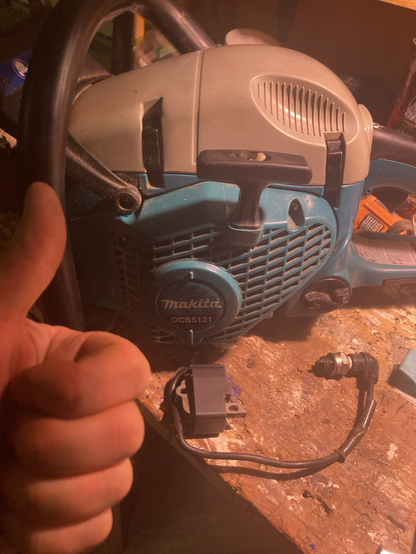 Chainsaw with faulty ignition coil and a thumbs up c