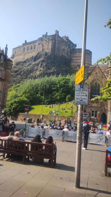 Grassmarket and Edinburgh Castle viewed from side window of a bus