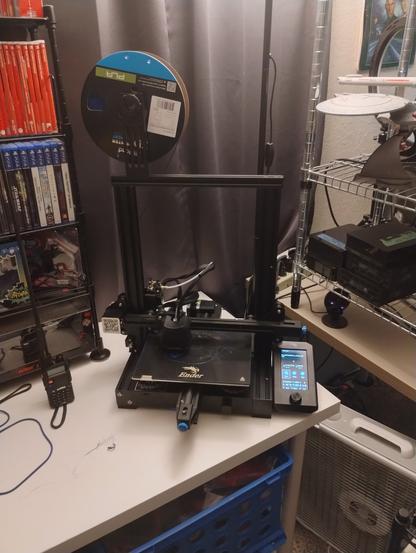 Creality Ender 3 v2 with blue filament just starting to print an ice dragon