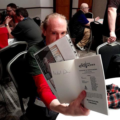 Brian holding up his copy of The Secret of Ronan Skerry which I signed in 2009.