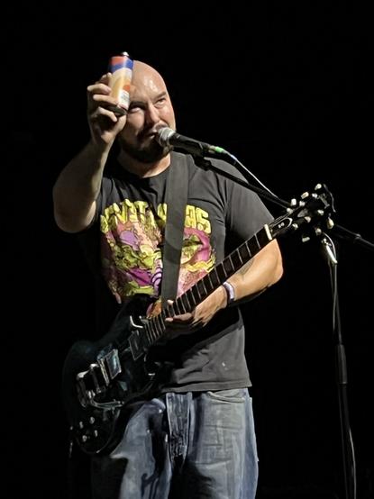 Mondo Generator guitarist Mike Pygmie having a Mondo Generator Beer live on stage at Desert Fest Berlin 2024.