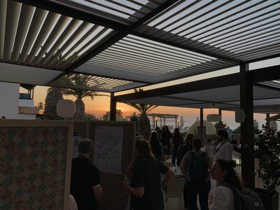 Poster session photo with sunset