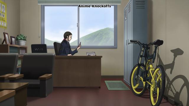 A lady sits at a desk with a WAIO laptop