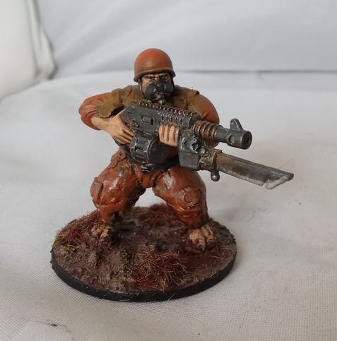 One ogyrn leveling his gun. It has a nasty bayonet.