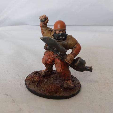 An ogyrn bonehead lobbing a grenade. He needs to adjust his gasmask.