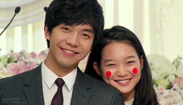 Lee Seung Gi in a suit & Shin Min Ah with red paper circles on her cheeks from 2010 South Korean drama "My Girlfriend is a Gumiho."