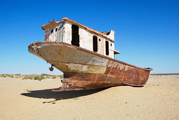 photo - abandoned boat in a dried up portion of the Aral Sea