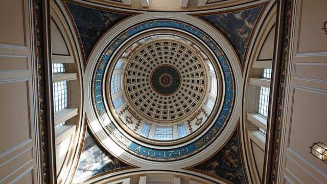 Looking up at the ornate plasterwork and windows in the main dome of the Georgian-era Town Hall