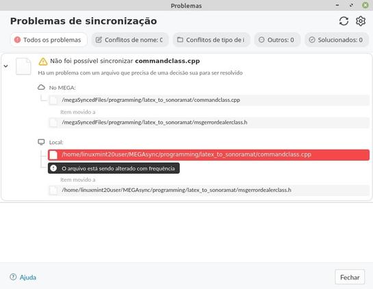 Screenshot from MEGAsync, talking about syncing issues. It says that one file has been moved to another.