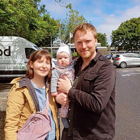 Denman Rooke with his wife and daughter outside their local polling station.