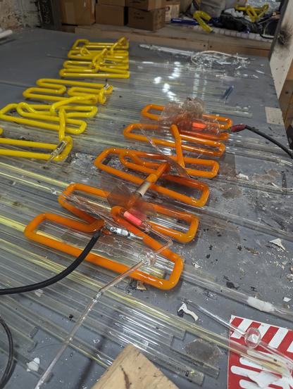 A hot yellow Italian glass "MAN" on the pump- right after bombarding.