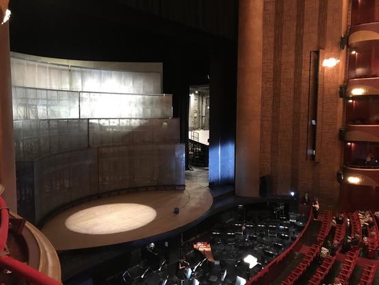 Stage being prepared for the show with a curved gray backdrop