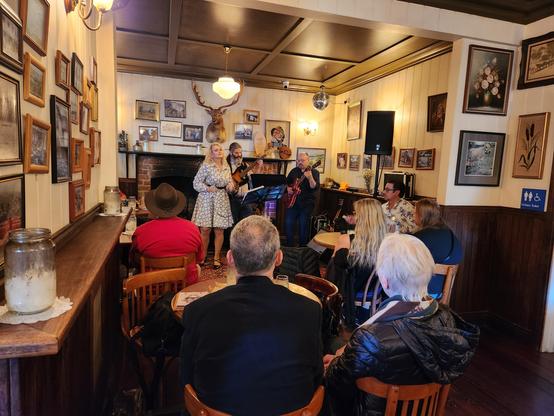 Small room in a cottage which is now a cool bar, small jazz group (with blonde female vocalist) in a corner.