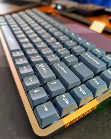 A close up shot of a Lowfree Flow keyboard with custom (not low profile) blue key caps.