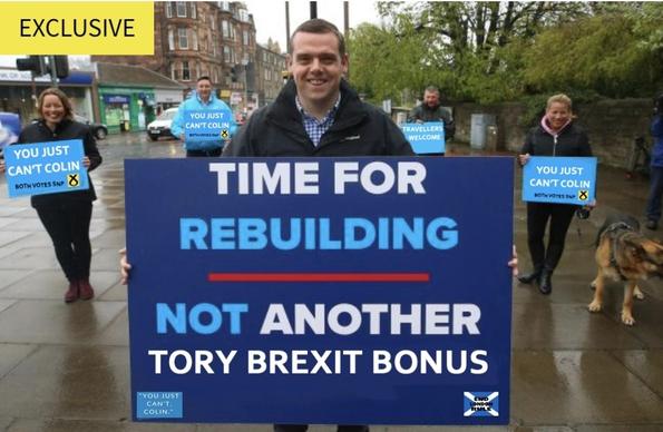 Douglas ross on the campaign trail with a brexit poster