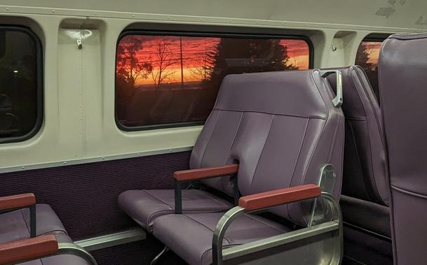 Sunrise through the window of a Blue Mountains train