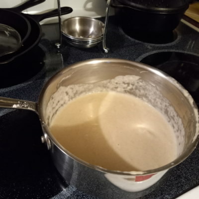 A pan of...white floury stuff....sits on a stove and this was the result of accidentally switching the flour and sugar weights in the recipe before I figured out what I did.

It tasted like sourdough starter. It really sucked.