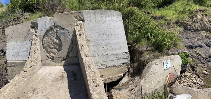 An old stormwater outfall has been blocked off and a new one runs beside it.
