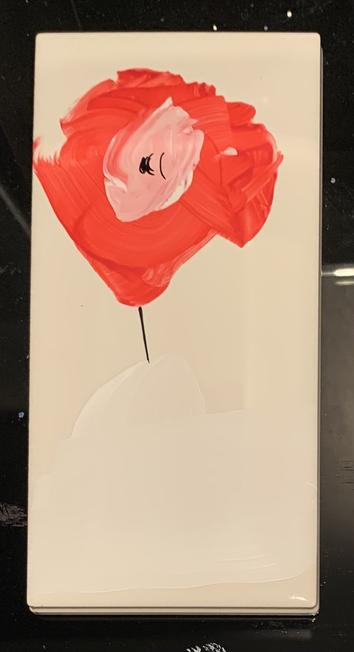 Abstract red flower on a white tile, portrait orientation