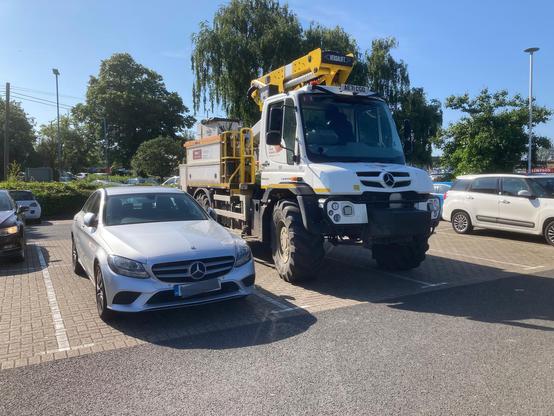 Mercedes Implement Carrier Unimog U530, frontal view, DW’s W205 for size comparison