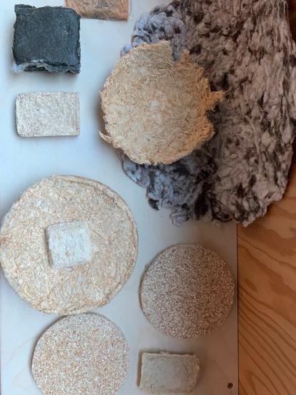 Several test samples, one including egg shells in the composite material.
