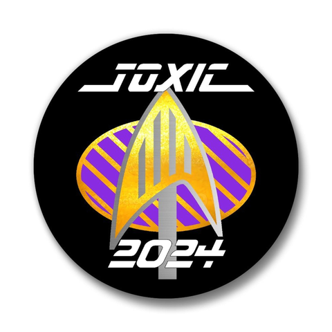 A badge with a send-up of the Star Trek badge with a grill grate and a spatula that looks like the communicator badge